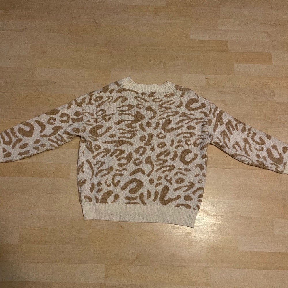 Cheetah print sweater.